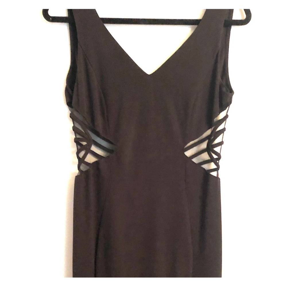 A formal black dress with see through sides